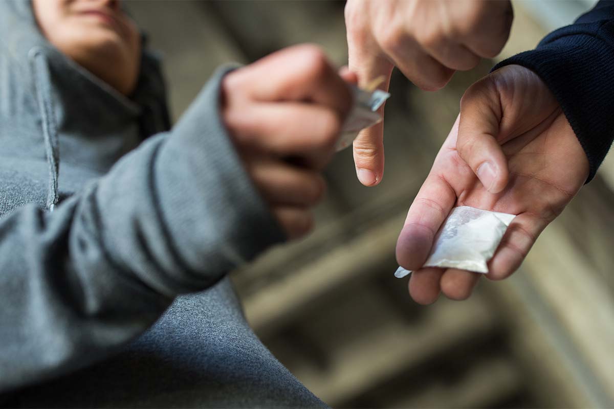 two people showing why teens use drugs