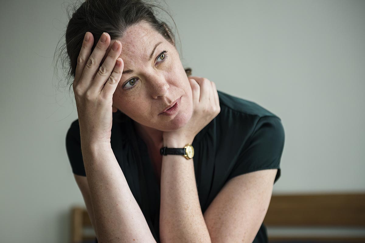 a woman is debating cocaine addiction treatment