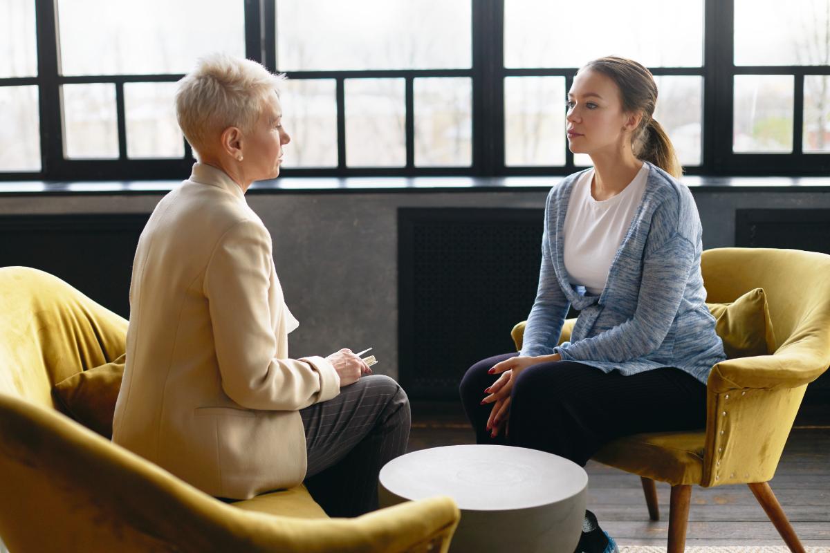 a woman is happy to have found an intensive outpatient program near me