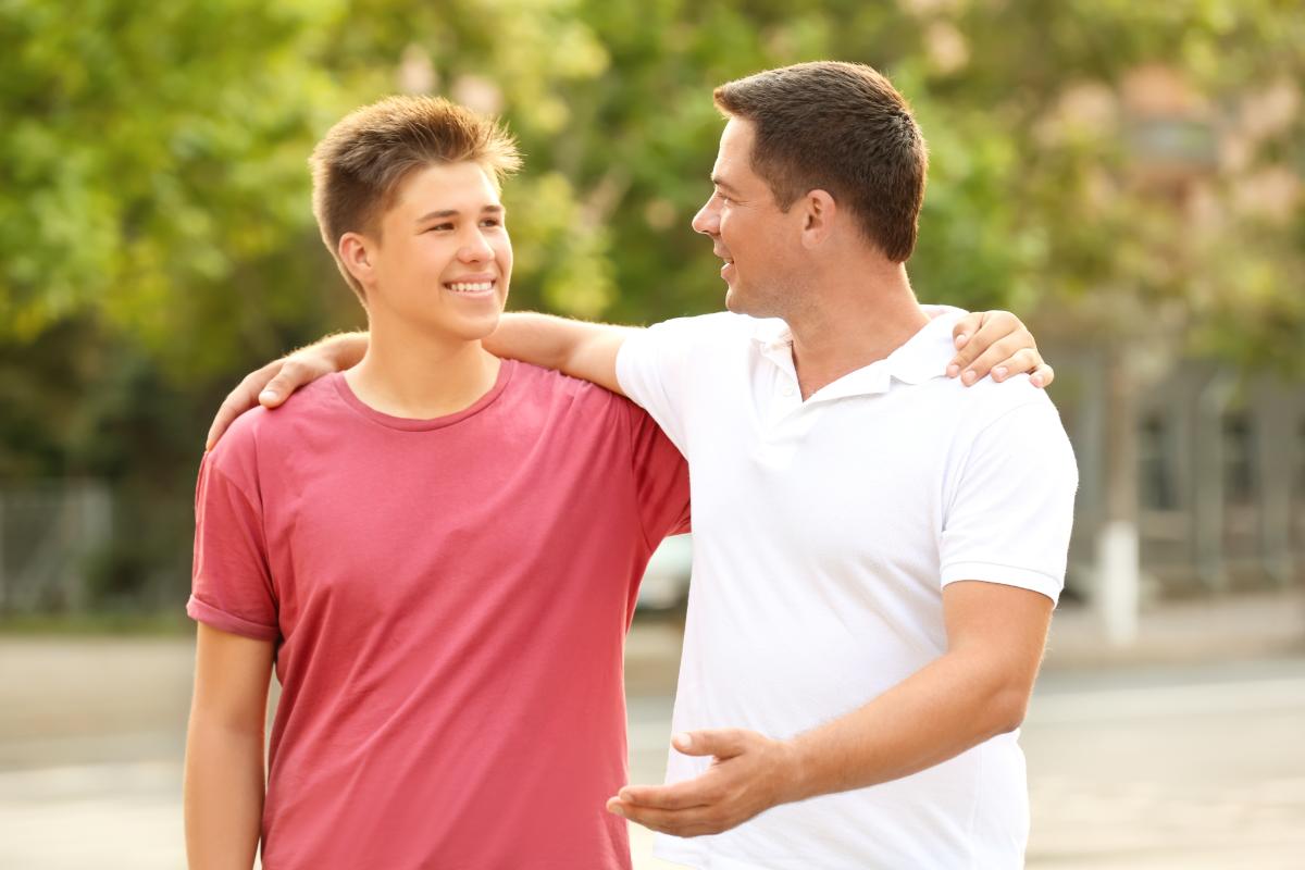 a dad talking to his son about adolescent addiction treatment in Fort Worth