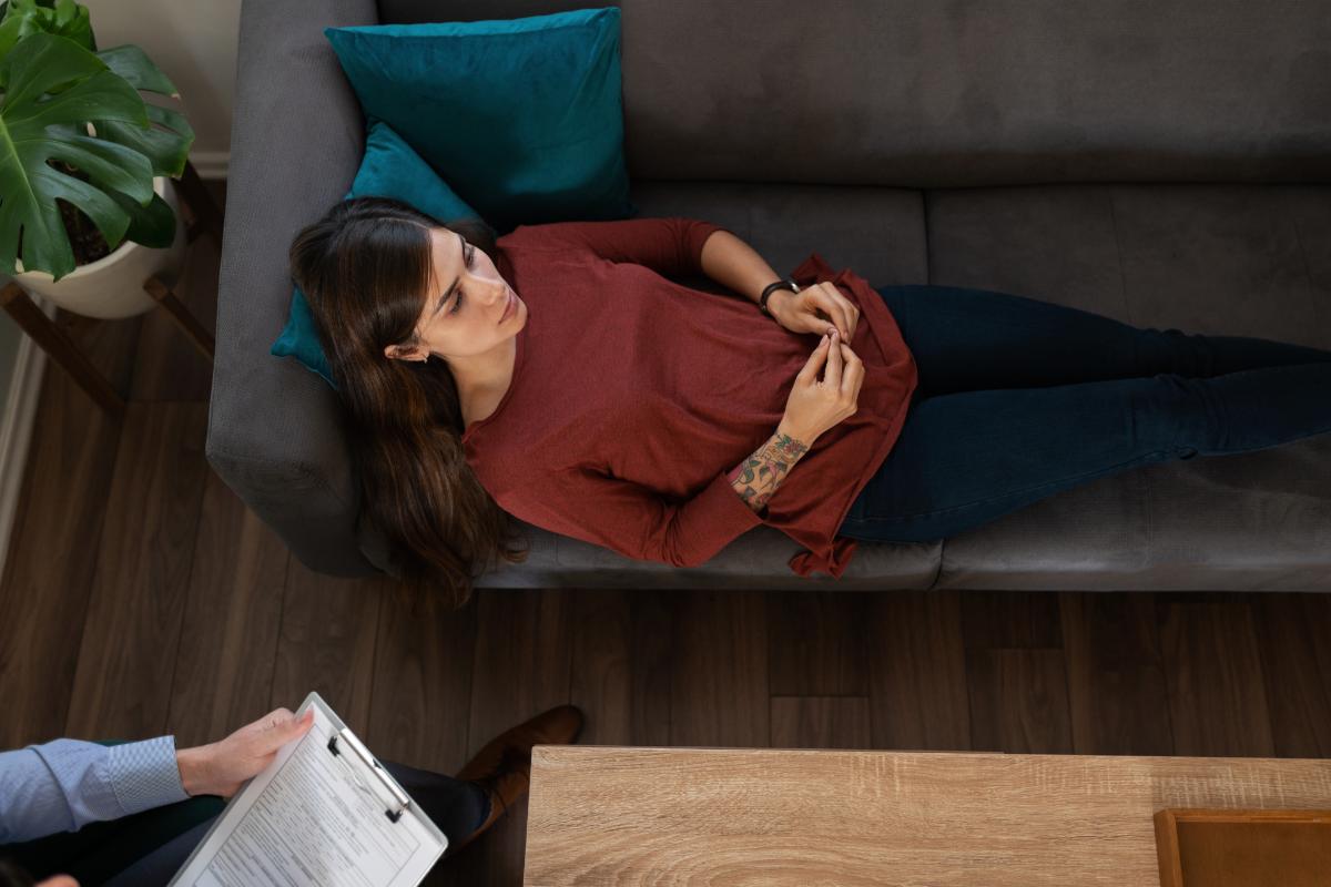 woman lying on therapist's couch in DBT for addiction program