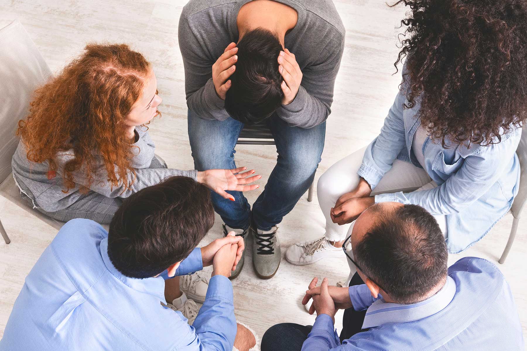 Group of people participating in a 12-step program for alcohol